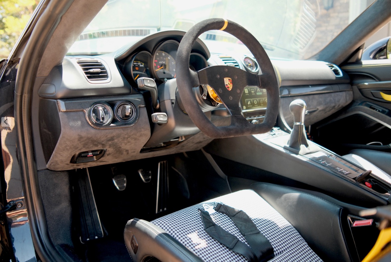 Porsche GT4 cockpit with houndstooth seat inserts