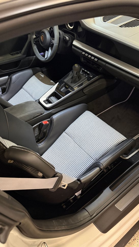 Porsche 992 GT3 interior with black and white houndstooth seat inserts and manual gearbox