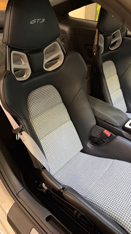 Porsche GT3 bucket seats with black and white houndstooth centers and contrast stitching