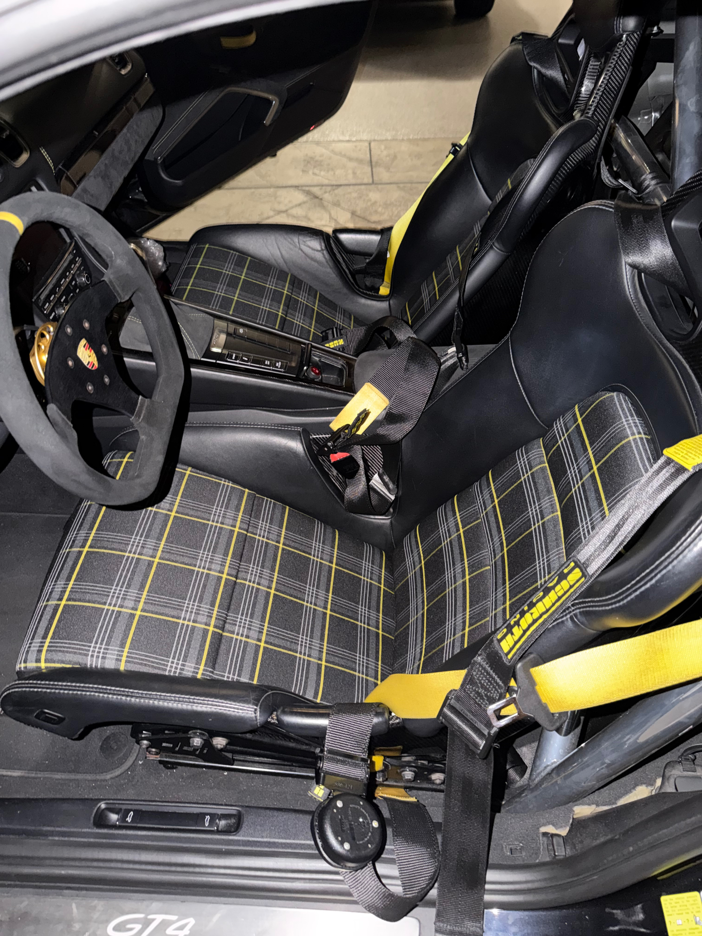 Porsche 718 GT4 lightweight bucket seats with grey and yellow tartan inserts