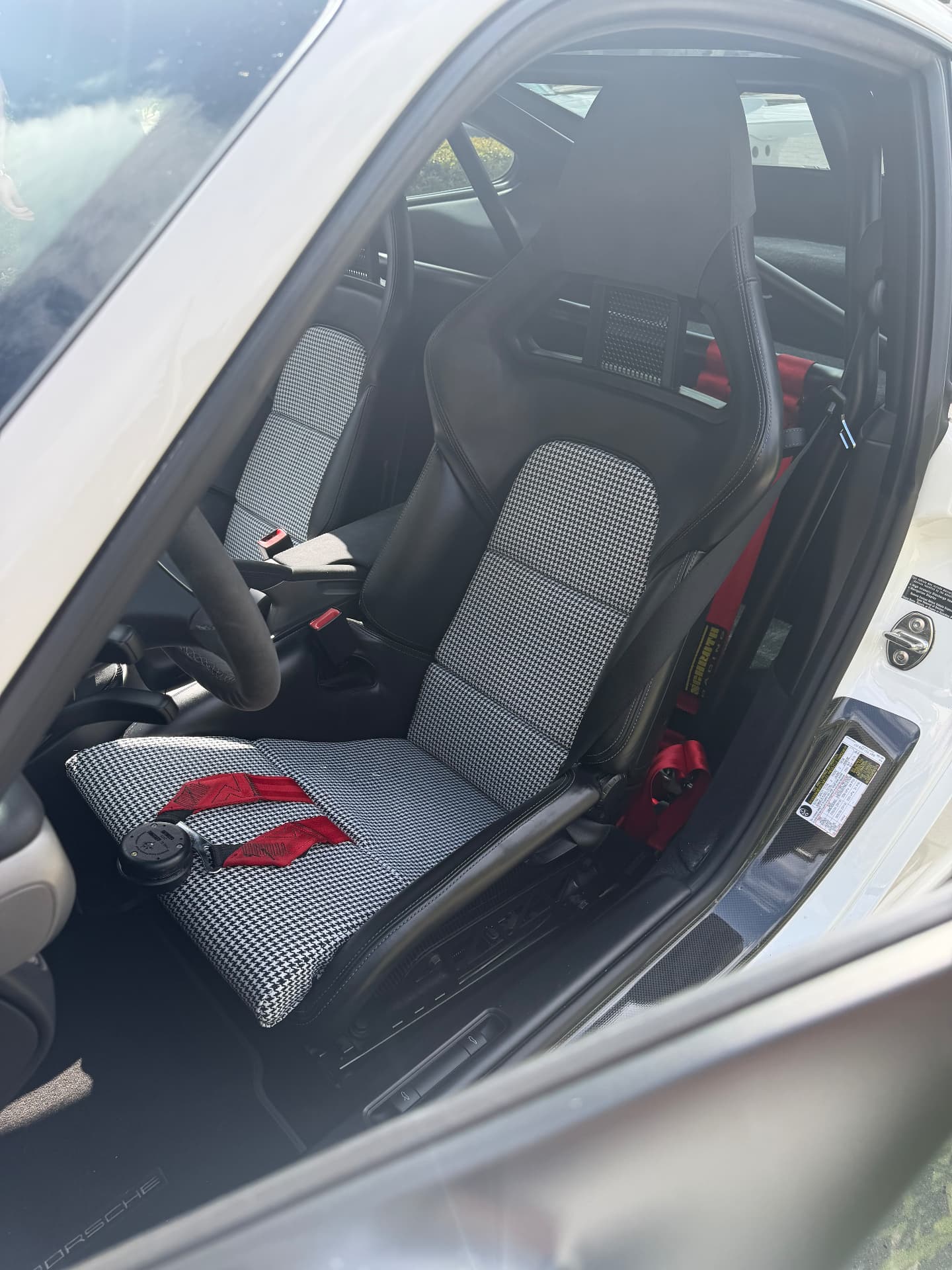 Houndstooth covers on a Porsche 997 folding bucket seat